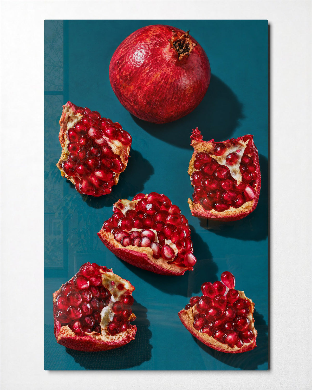 Teal Table, Red Seeds glass wall art, front view