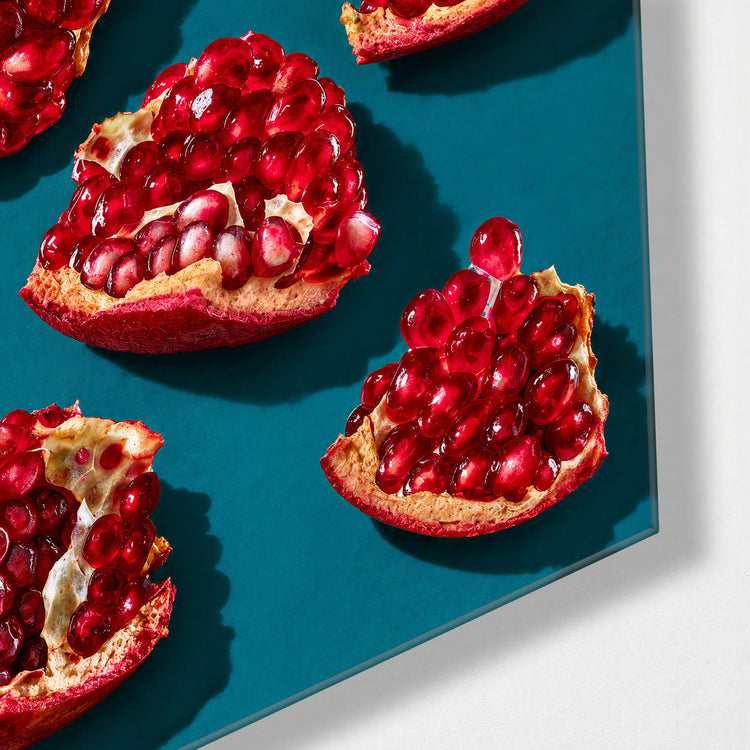 Teal Table, Red Seeds glass wall art, corner view