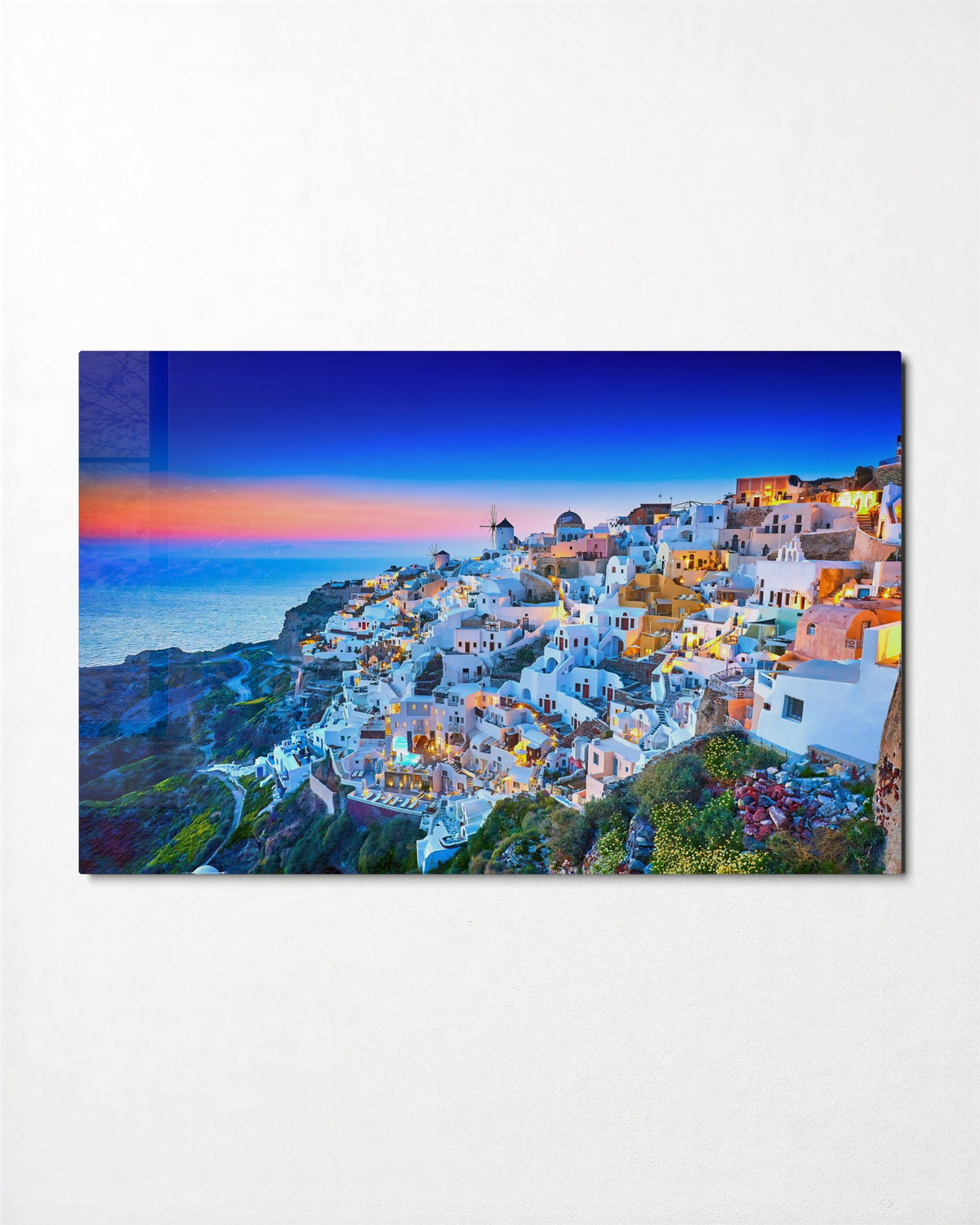 Cliffside Village at Dusk glass wall art, front view
